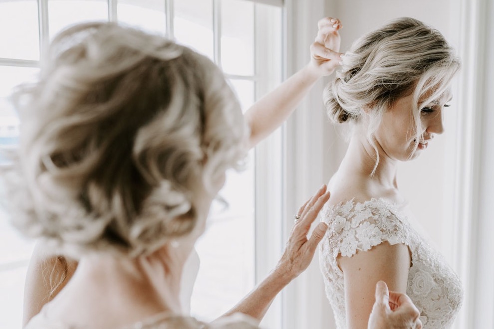 mother fixing bride's hair