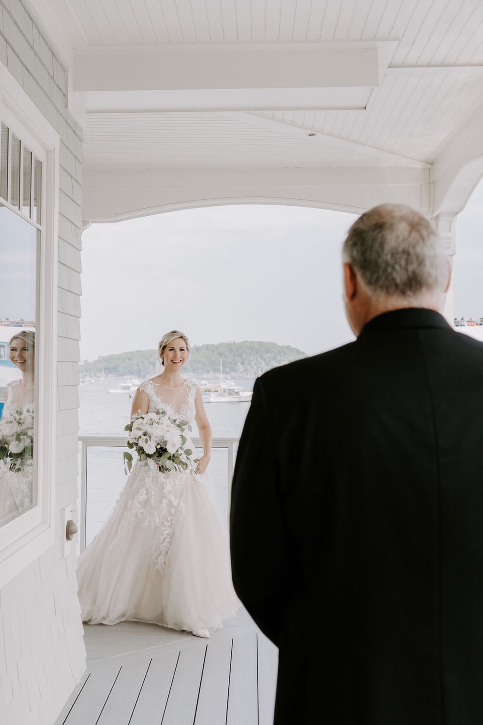 bride walking out toward her father for first look