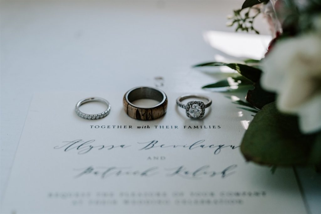 wedding invitation and wedding rings