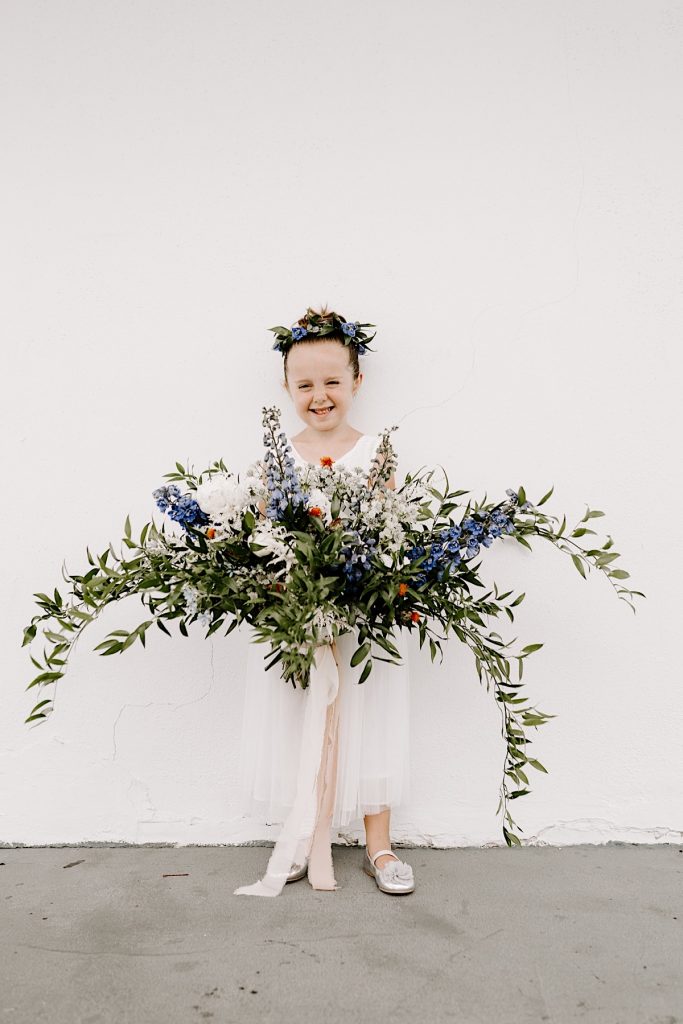 flower girl with giant bouquet